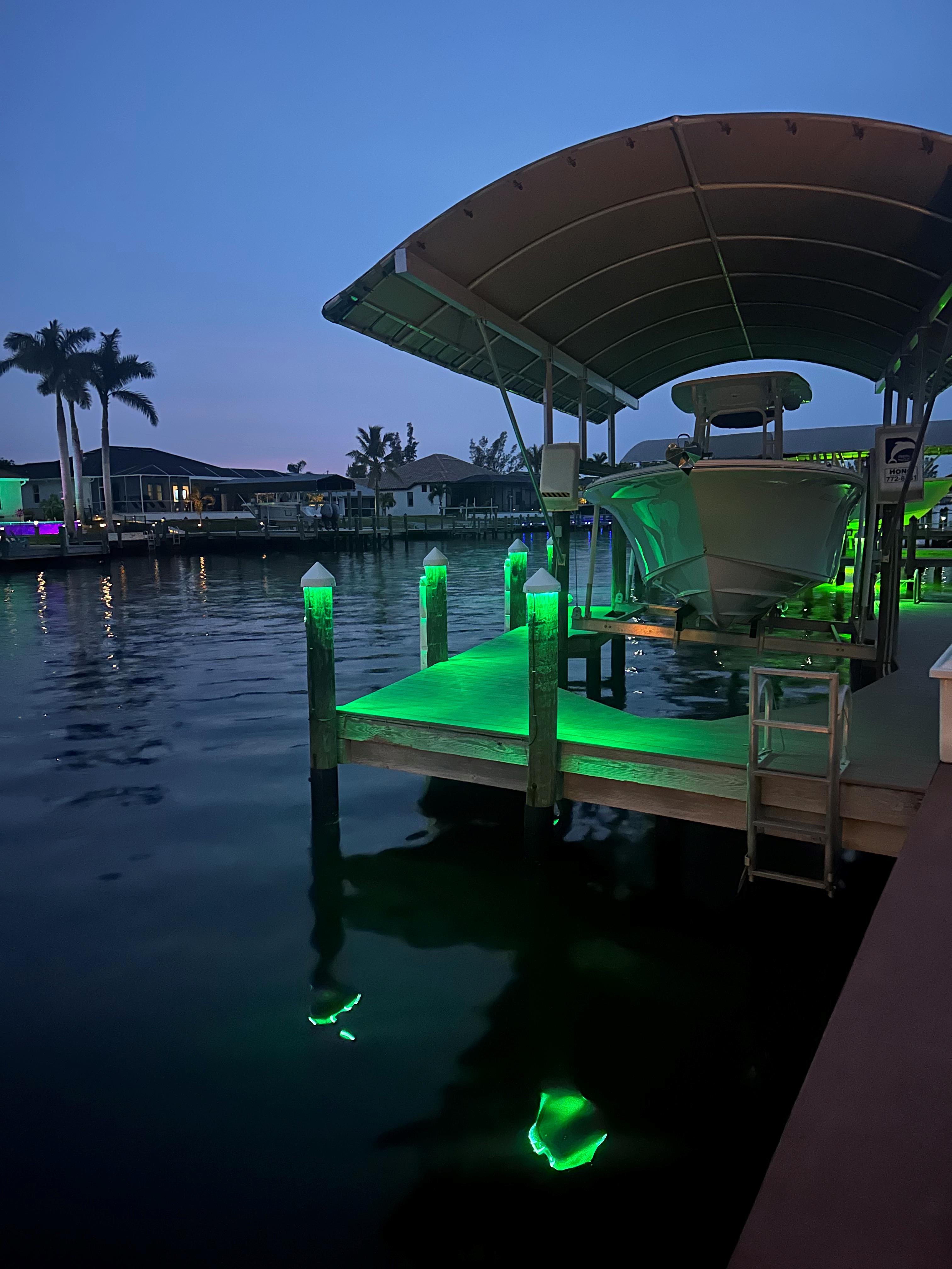 illuminated boat dock with energy-efficient LED lighting on a canal home in Lee County